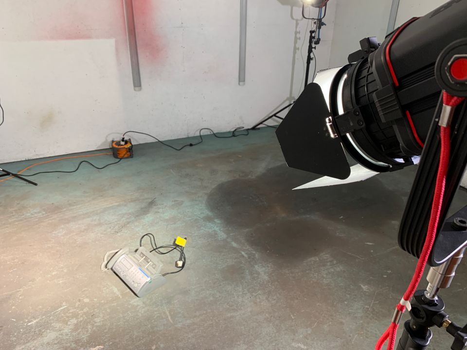 Light shining on fax machine on set